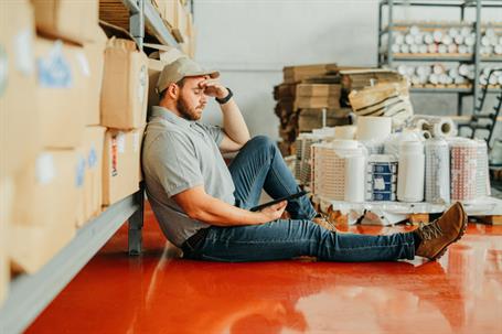 tired worker resting on the floor